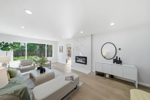 a living room with furniture a large window and a large window