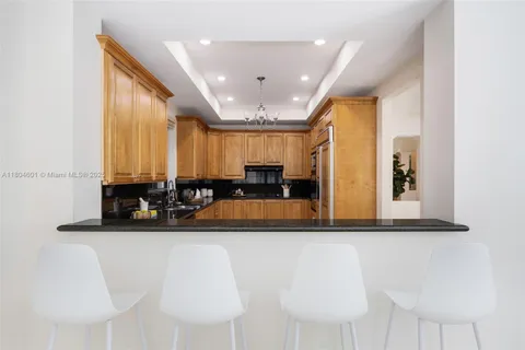 a view of a living room and kitchen