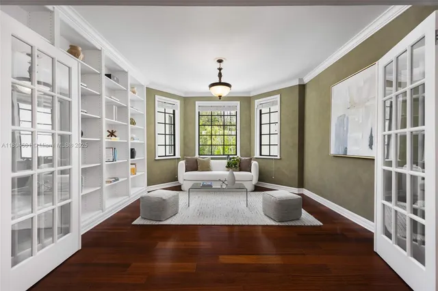 a living room with furniture window and wooden floor
