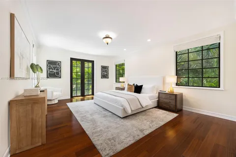 a spacious bedroom with a large bed and a couch