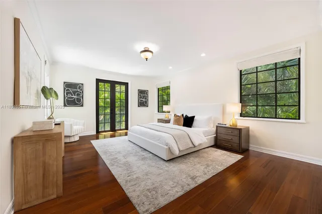 a spacious bedroom with a large bed and a couch