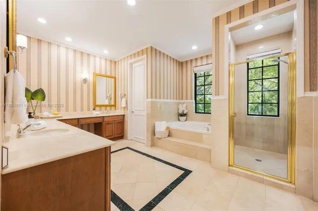 a spacious bathroom with a tub shower and sink