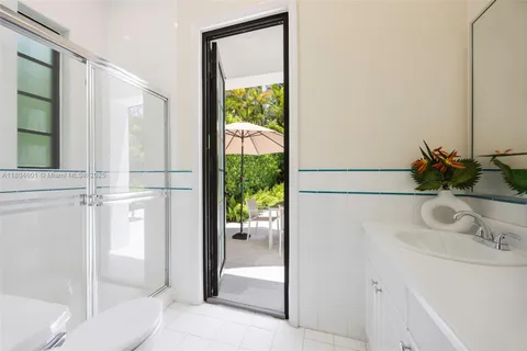 a bathroom with a sink and a large mirror