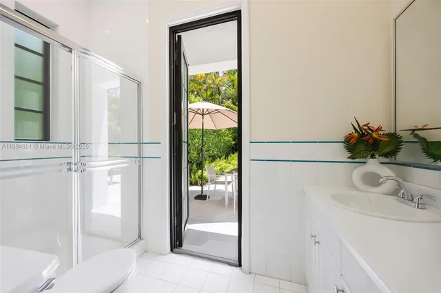 a bathroom with a sink and a large mirror