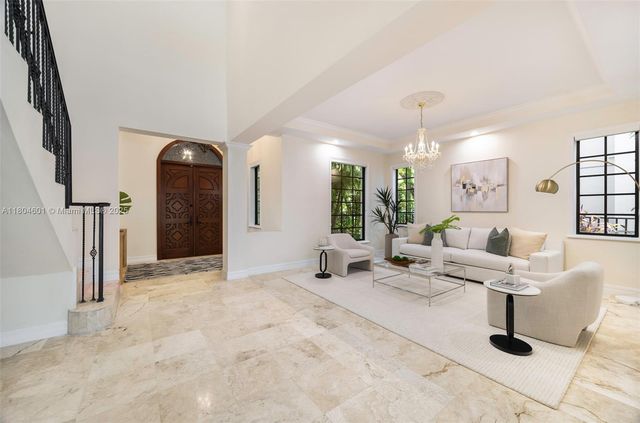 a lobby with furniture and window