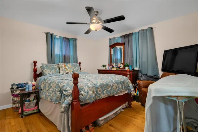 a bedroom with bed and window