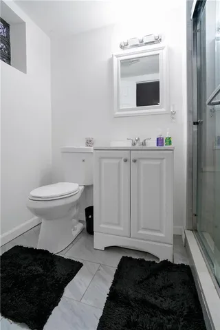 a bathroom with a toilet and a sink
