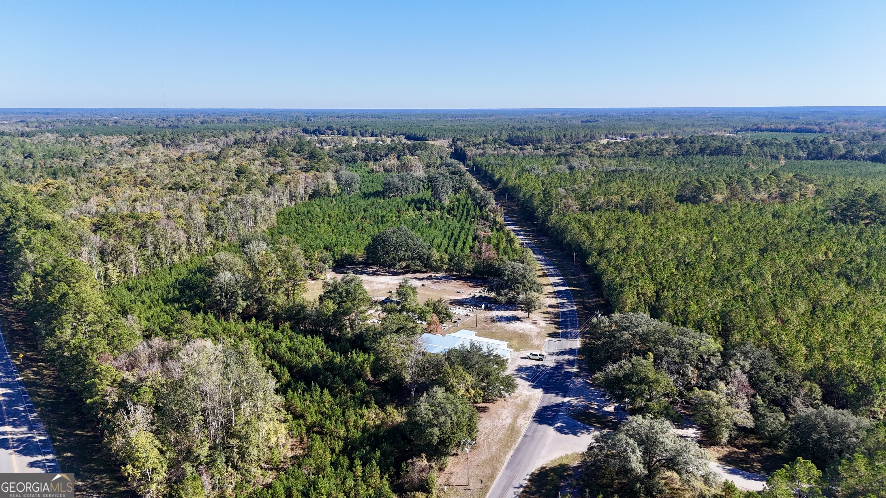 0 Bachlott Church Road Nahunta, GA 31553 - Photo 7 of 10 a view of a city with lush green forest