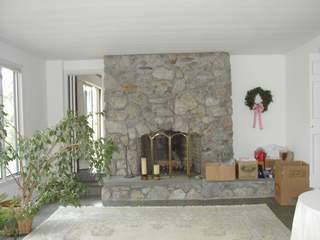 Undisclosed Address Centerville, MA 02632 - Photo 4 of 4 a living room with furniture and potted plants