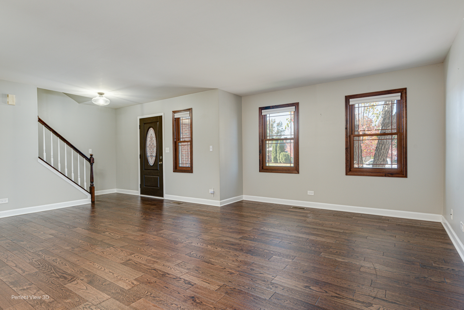 512 Bison Road Oswego, IL 60543 - Photo 3 of 45 a view of an empty room with wooden floor and a window