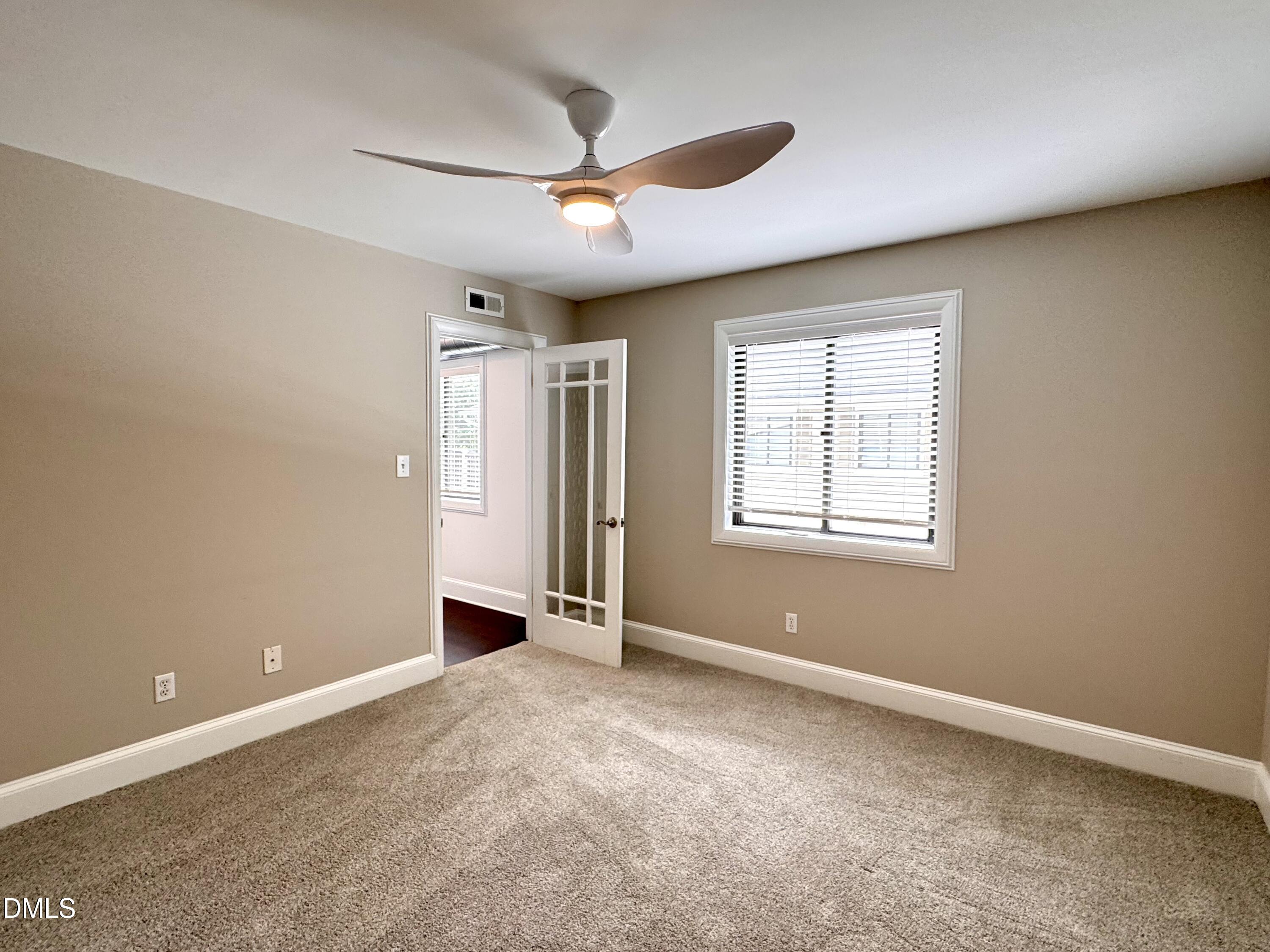 2204 Stafford Avenue, Unit 202 Raleigh, NC 27607 - Photo 8 of 15 a view of an empty room with a window