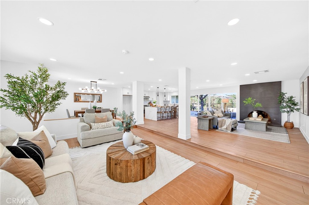 930 Rancho Circle Fullerton, CA 92835 - Photo 11 of 57 a living room with furniture and a large mirror with potted plants