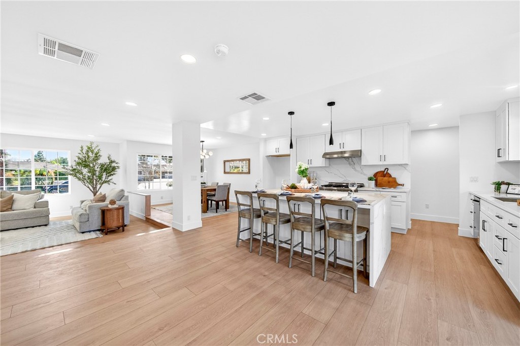 930 Rancho Circle Fullerton, CA 92835 - Photo 19 of 57 a kitchen with stainless steel appliances granite countertop a stove top oven a sink a counter space and cabinets