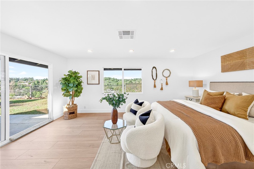 930 Rancho Circle Fullerton, CA 92835 - Photo 28 of 57 a spacious bedroom with a large bed and a large window