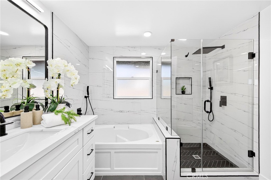 930 Rancho Circle Fullerton, CA 92835 - Photo 33 of 57 a bathroom with a shower sink and mirror