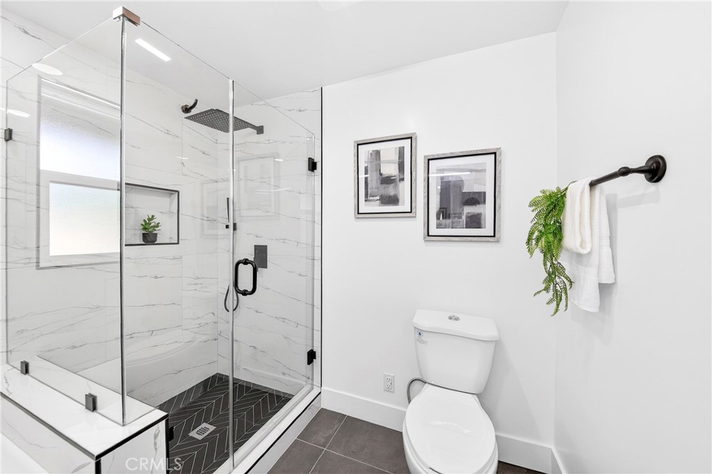 930 Rancho Circle Fullerton, CA 92835 - Photo 35 of 57 a bathroom with a shower a toilet and sink