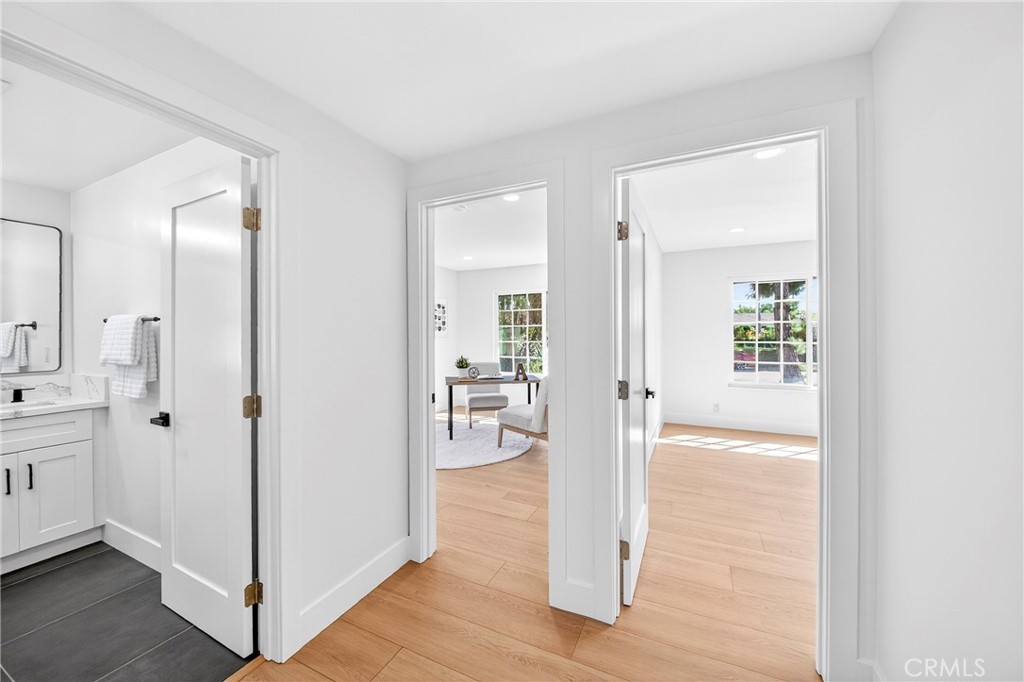 930 Rancho Circle Fullerton, CA 92835 - Photo 37 of 57 a view of a hallway with wooden floor and a bathroom