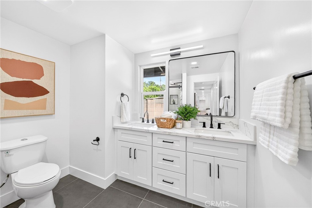 930 Rancho Circle Fullerton, CA 92835 - Photo 40 of 57 a bathroom with a sink and a toilet