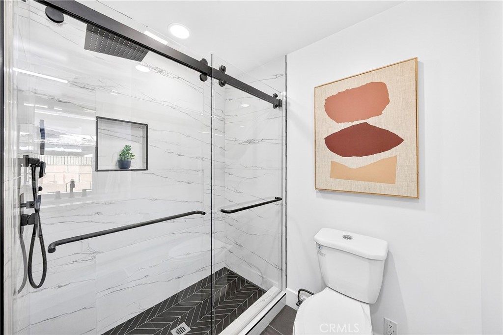 930 Rancho Circle Fullerton, CA 92835 - Photo 41 of 57 a bathroom with a shower and a toilet