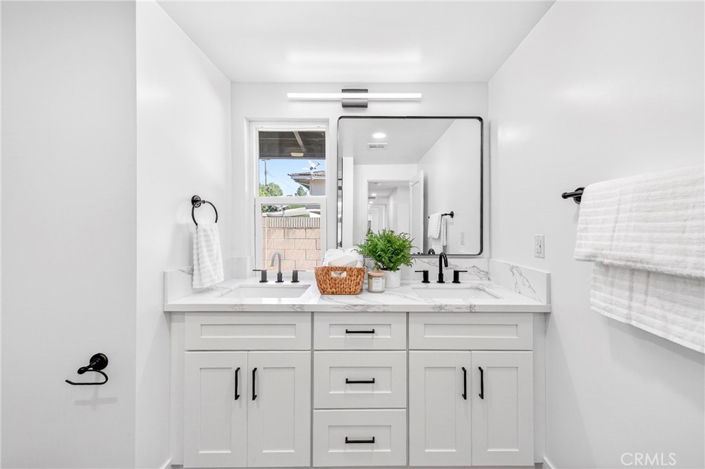 930 Rancho Circle Fullerton, CA 92835 - Photo 42 of 57 a bathroom with a sink and a mirror