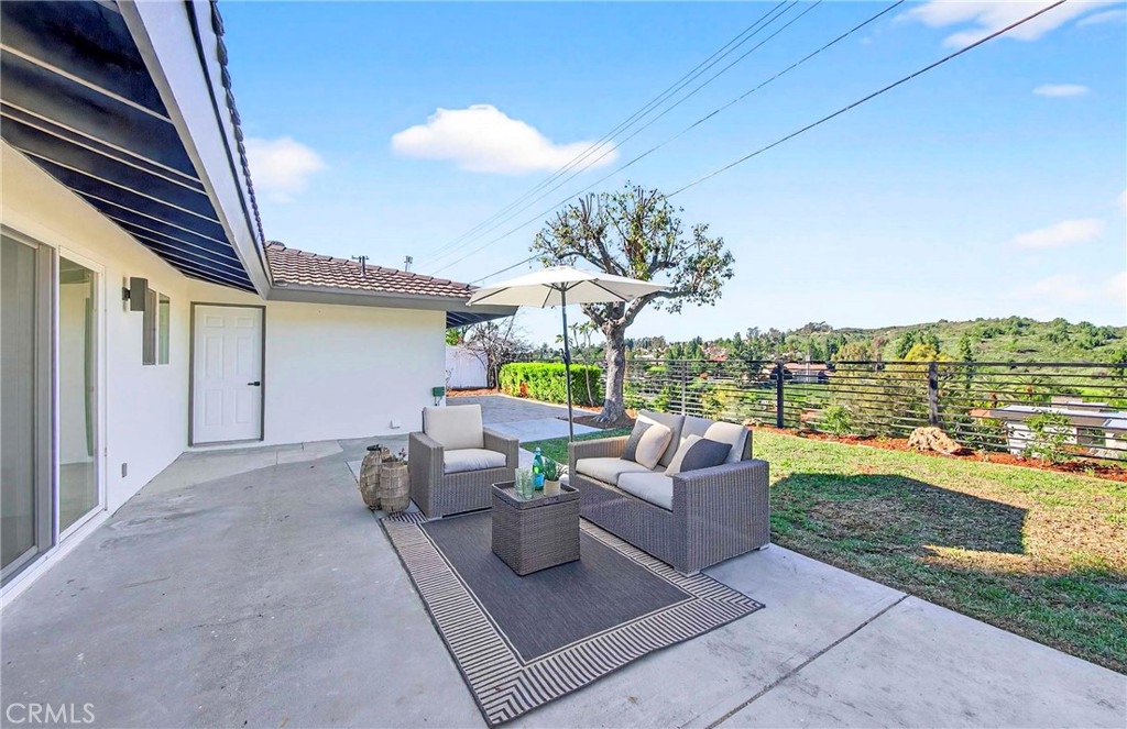 930 Rancho Circle Fullerton, CA 92835 - Photo 47 of 57 a view of a patio with couches and a table and chairs