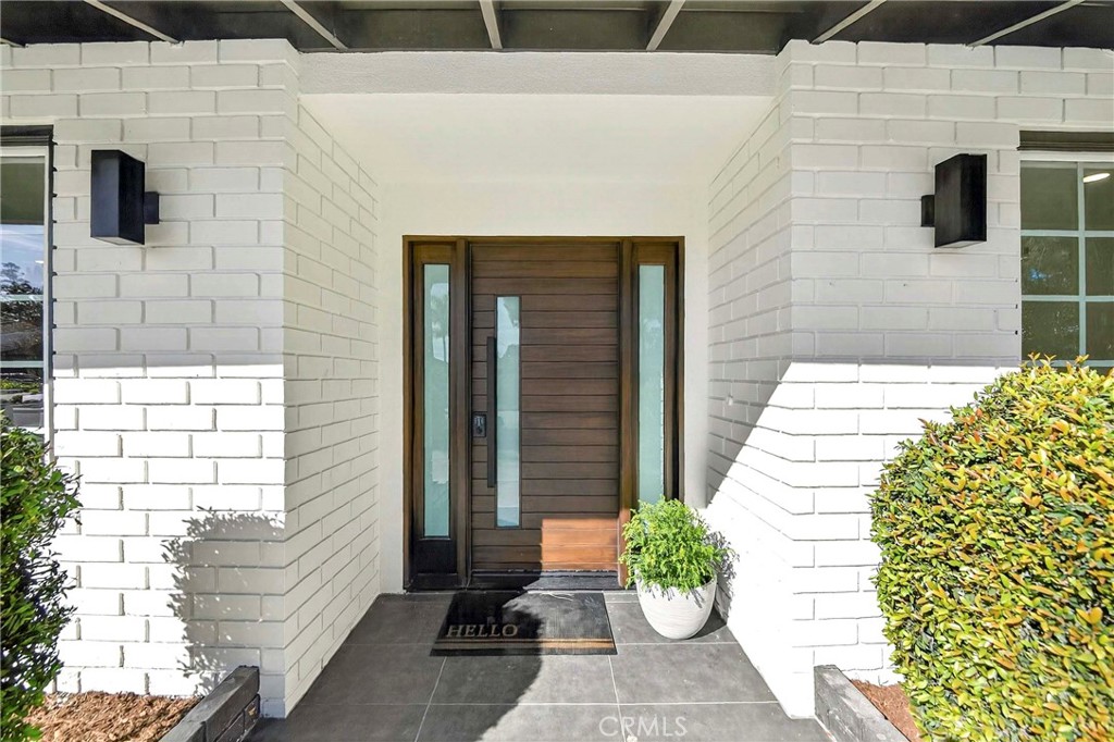 930 Rancho Circle Fullerton, CA 92835 - Photo 6 of 57 a front view of a house with a garden