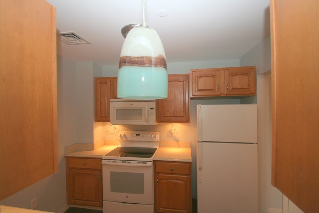 7 Assinippi Avenue, Unit 306 Norwell, MA 02061 - Photo 11 of 20 a utility room with dryer and washer