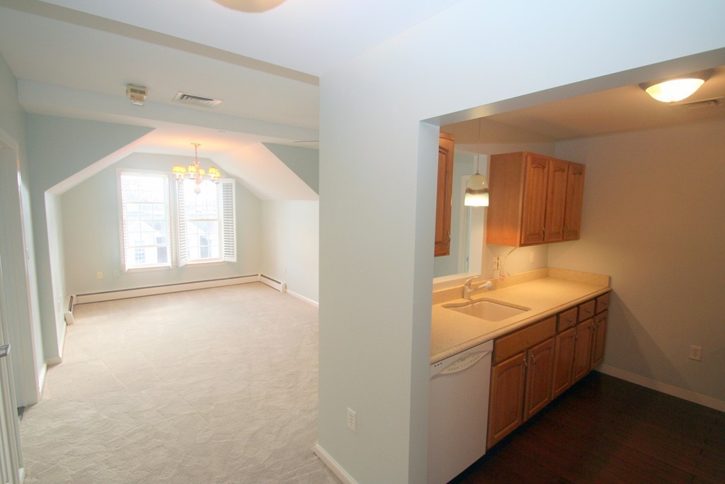 7 Assinippi Avenue, Unit 306 Norwell, MA 02061 - Photo 3 of 20 a bathroom with a sink and a mirror