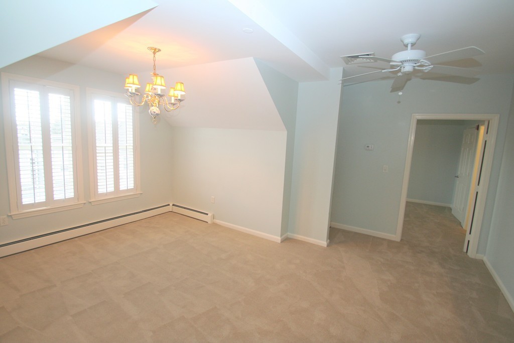 7 Assinippi Avenue, Unit 306 Norwell, MA 02061 - Photo 4 of 20 wooden floor in an empty room with a window