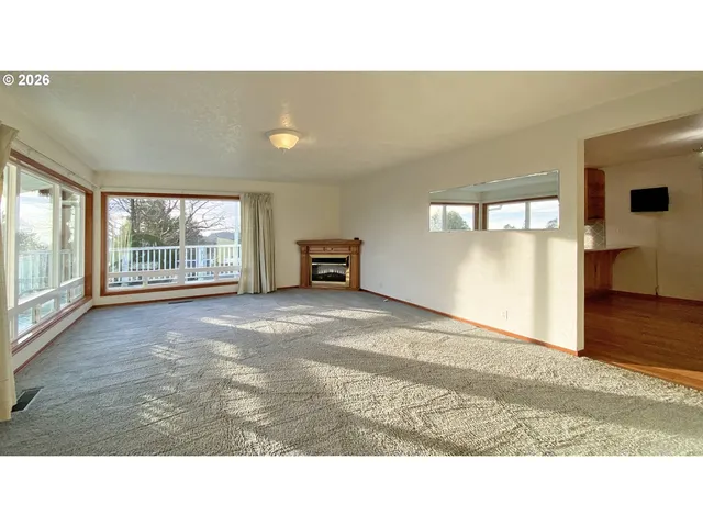 a bathroom with a sink a toilet a mirror and shower