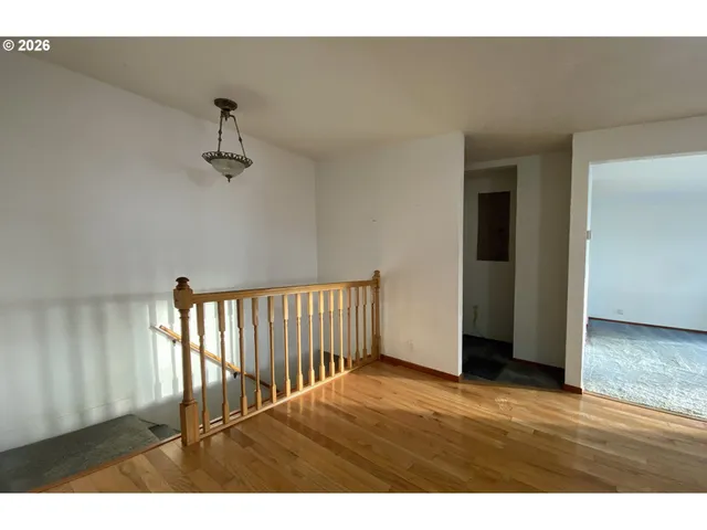 a view of a entryway door with hallway