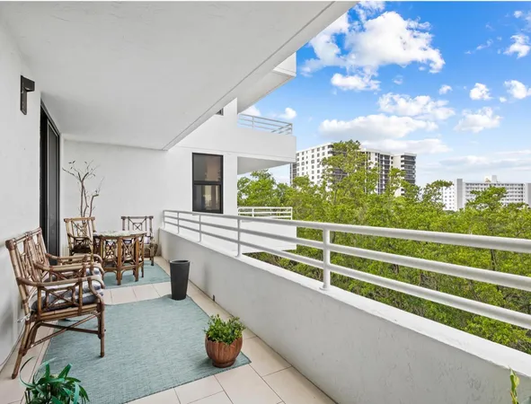 a view of a balcony with chairs