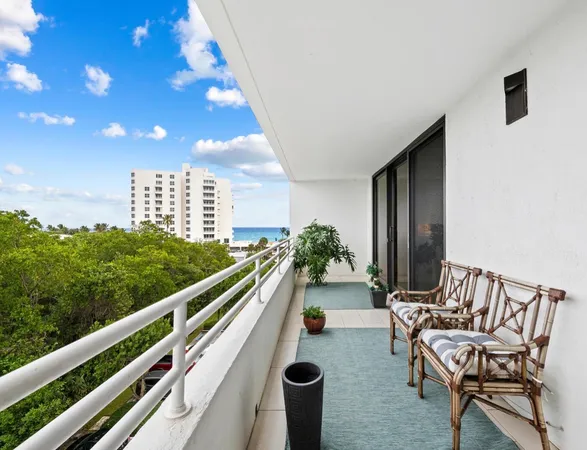 a balcony with chairs