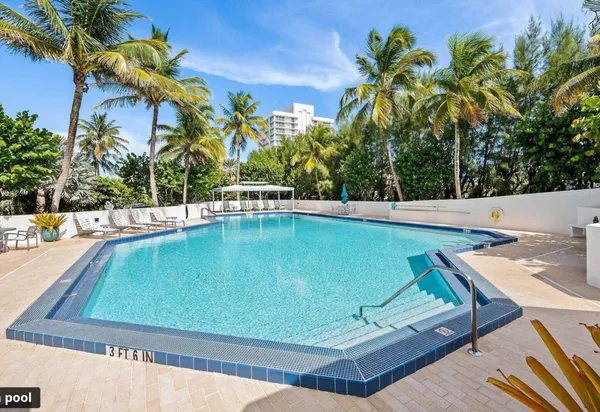 a view of a swimming pool with a patio