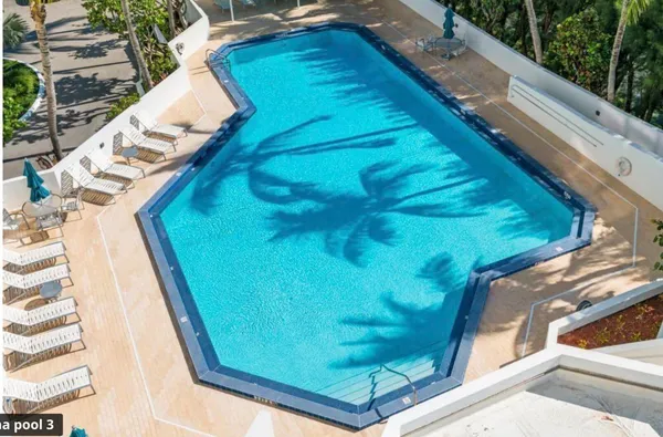 a view of swimming pool from a balcony