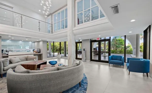 a living room with furniture and a large window