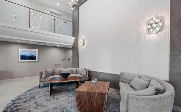 a living room with furniture and a rug