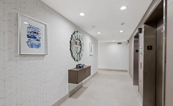 a view of a hallway with seating area