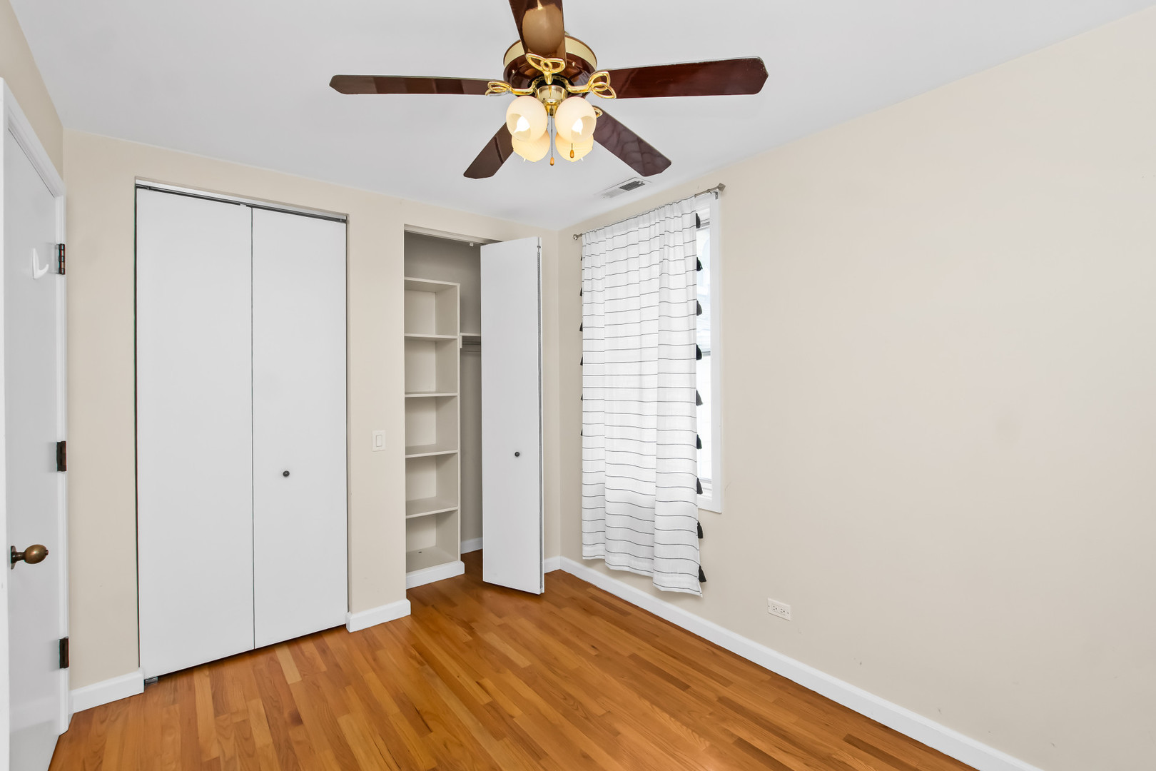 2238 West 21st Place Chicago, IL 60608 - Photo 10 of 37 a view of an empty room with a ceiling fan