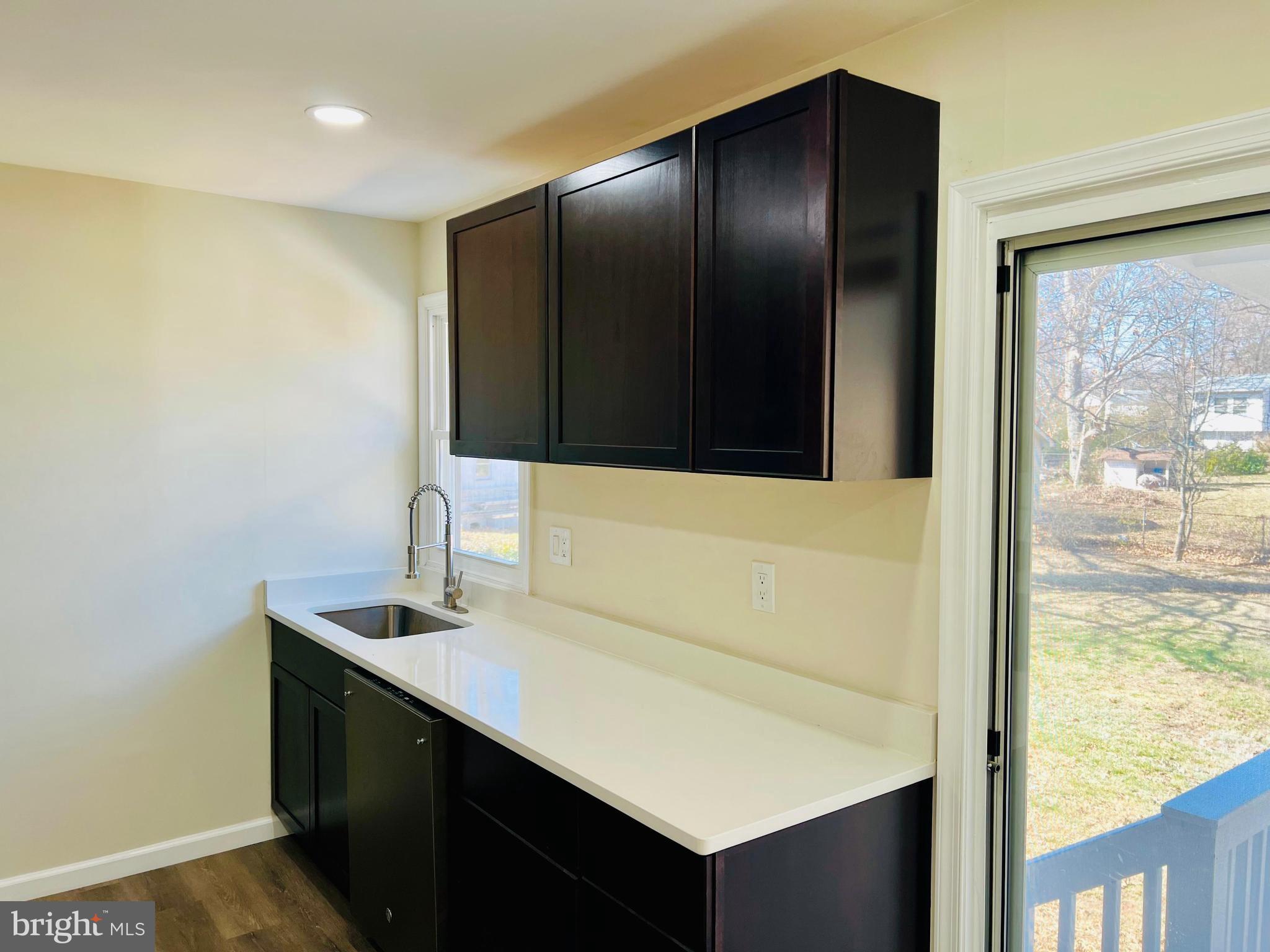 9826 Lomond Drive Manassas, VA 20109 - Photo 14 of 78 a bathroom with a sink and a mirror