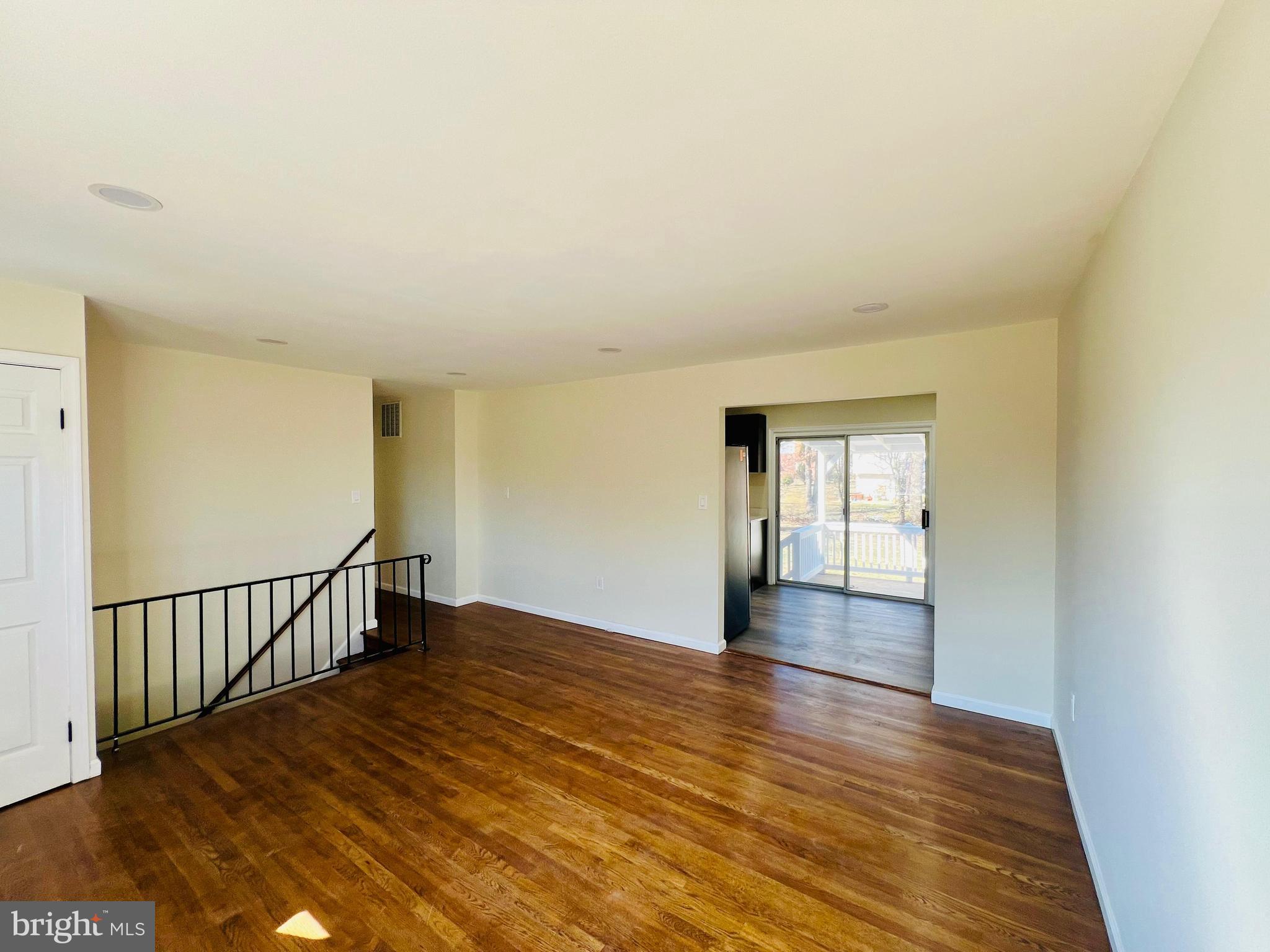 9826 Lomond Drive Manassas, VA 20109 - Photo 18 of 78 a view of an empty room with wooden floor