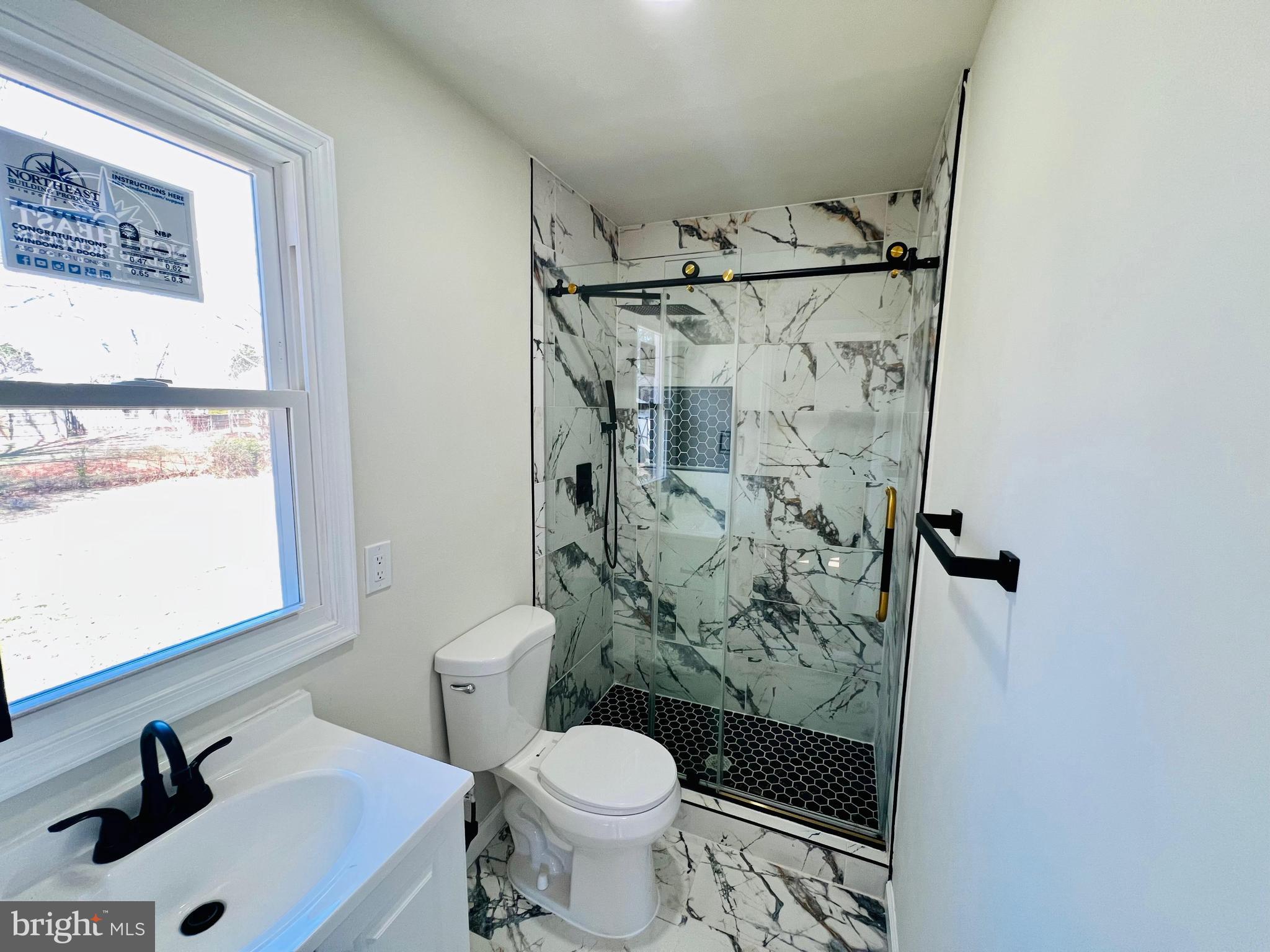 9826 Lomond Drive Manassas, VA 20109 - Photo 28 of 78 a bathroom with a sink toilet and shower