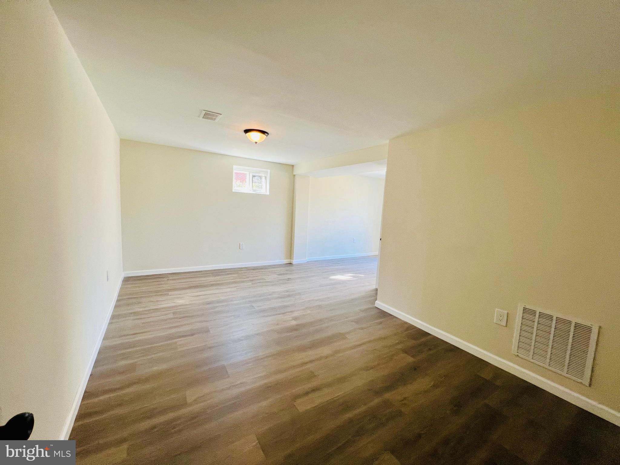 9826 Lomond Drive Manassas, VA 20109 - Photo 41 of 78 a view of an empty room with wooden floor