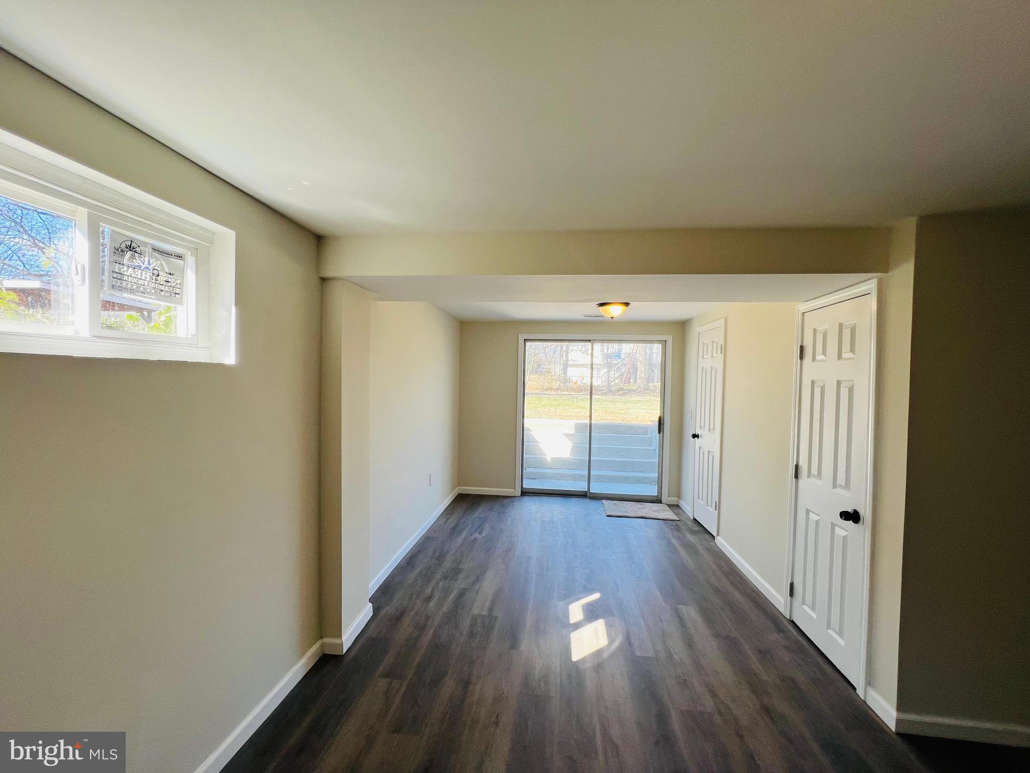 9826 Lomond Drive Manassas, VA 20109 - Photo 42 of 78 a view of a hallway with wooden floor