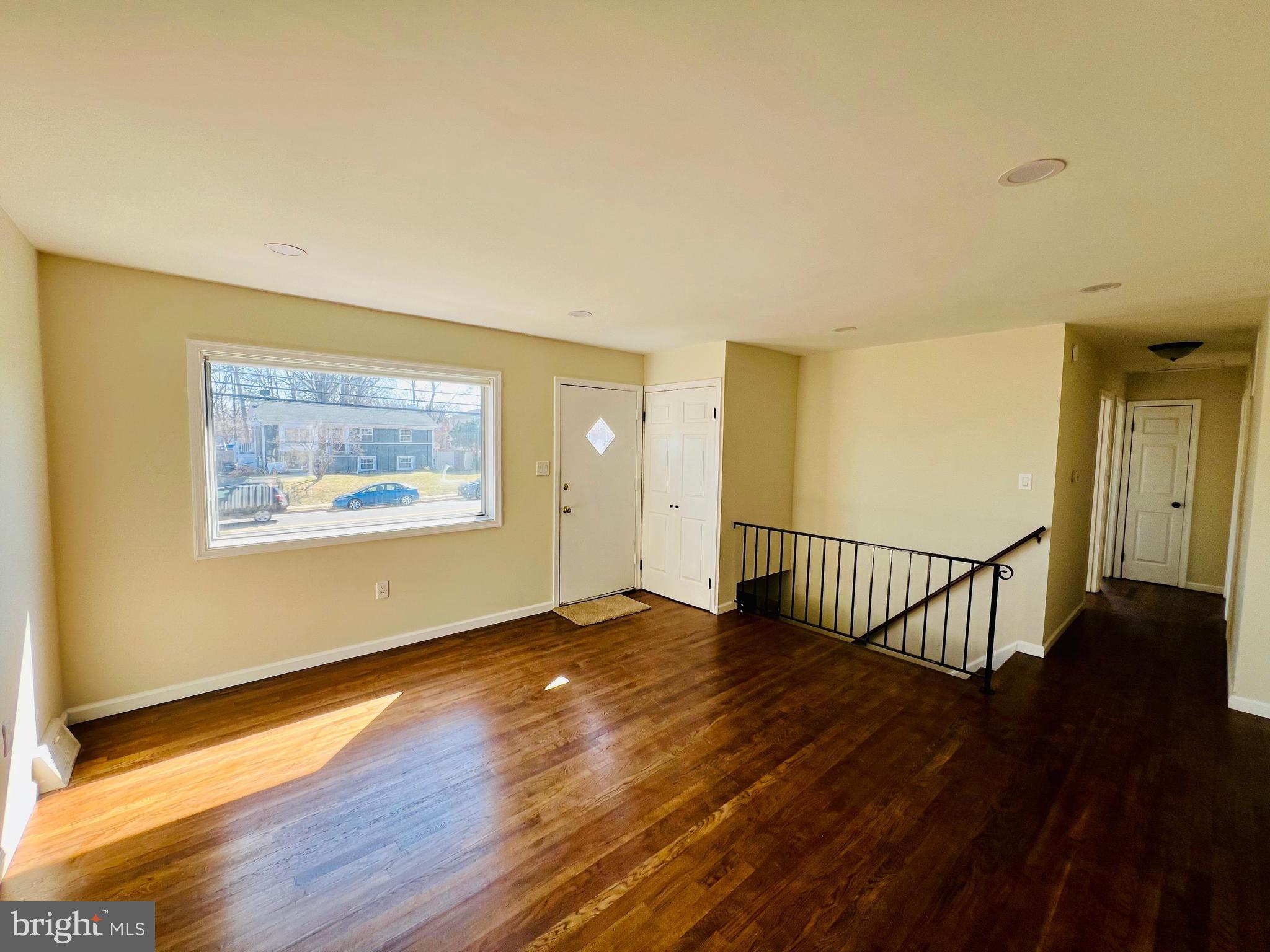9826 Lomond Drive Manassas, VA 20109 - Photo 5 of 78 a view of an empty room with wooden floor