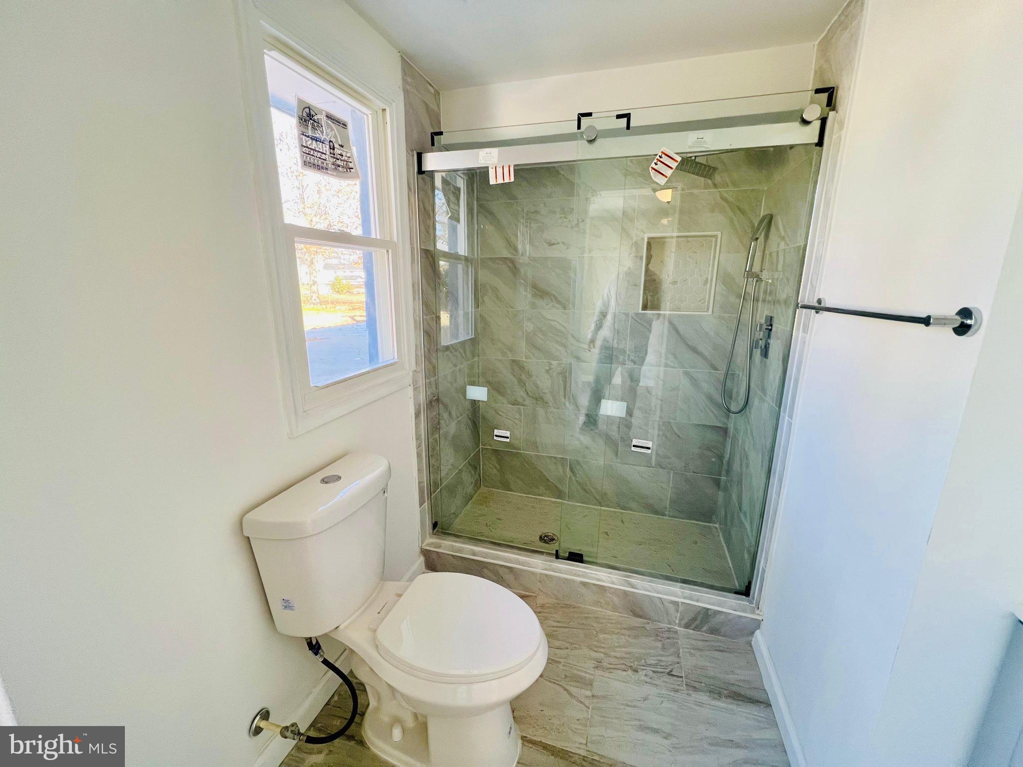 9826 Lomond Drive Manassas, VA 20109 - Photo 54 of 78 a bathroom with a shower and a toilet