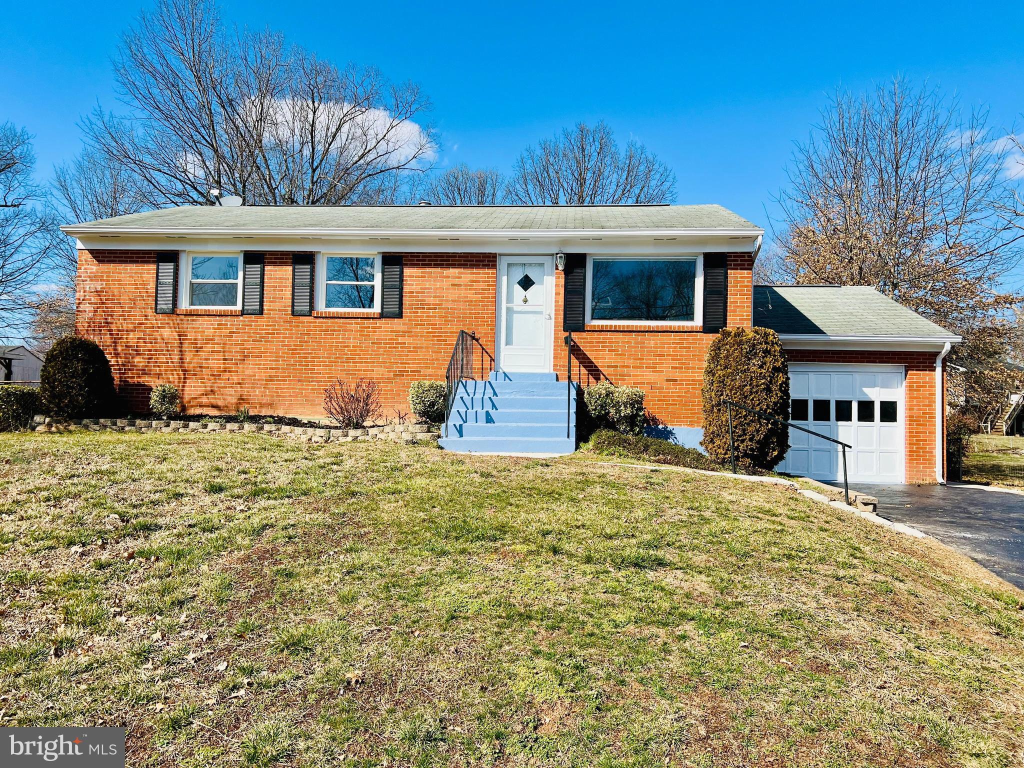 9826 Lomond Drive Manassas, VA 20109 - Photo 69 of 78 a front view of a house with a yard