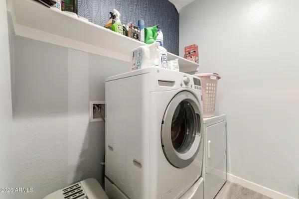 a utility room with dryer and washer