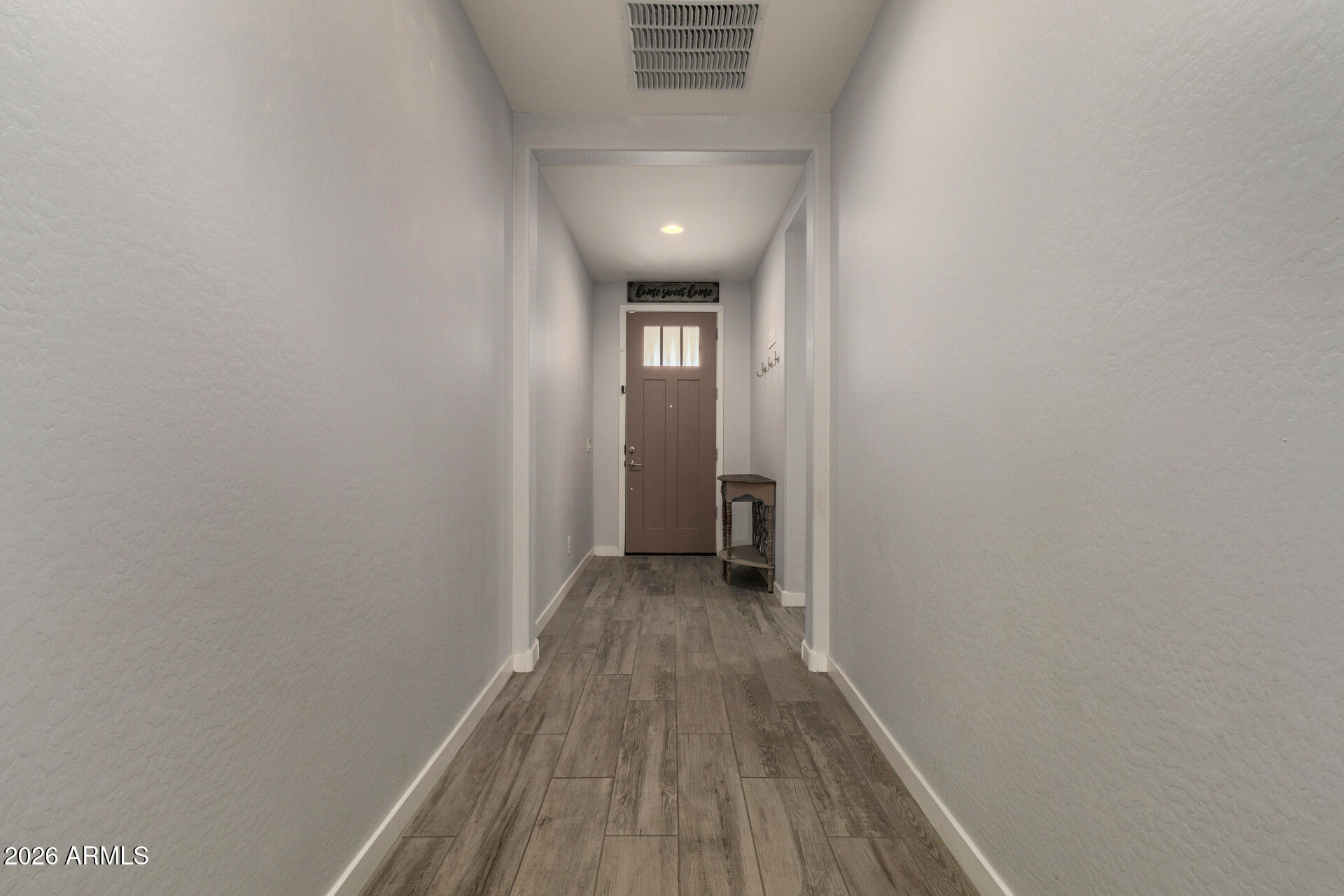 12560 East Ballentine Road Gold Canyon, AZ 85118 - Photo 6 of 35 a view of a hallway with wooden floor
