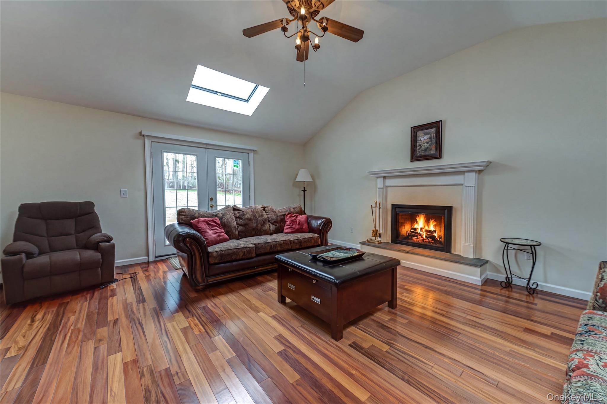 114 Randall Road Ridge, NY 11961 - Photo 11 of 48 a living room with furniture and a fireplace